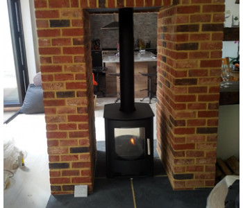 Mendip Churchill 8 Double Sided Multi-fuel stove - completed with bricks slips by our installers in Woking, Surrey.